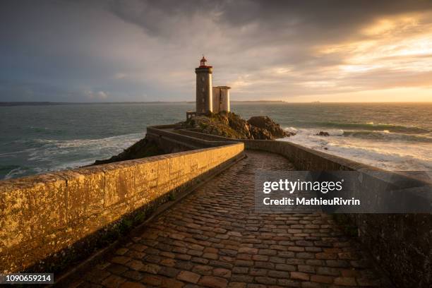 light after storm - amazing lighthouse "petit minou" in bretagne - ブレスト ストックフォトと画像