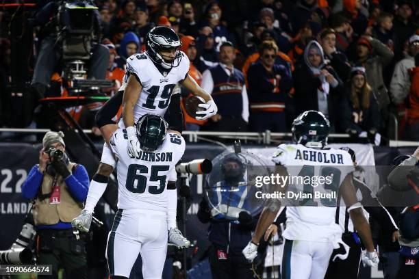 Golden Tate celebrates with Lane Johnson of the Philadelphia Eagles after scoring a touchdown against the Chicago Bears in the fourth quarter of the...