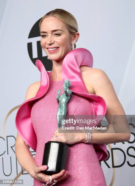 Emily Blunt poses in the press room with the award for Outstanding Performance by a Female Actor in a Supporting Role in 'A Quiet Place,' during the...