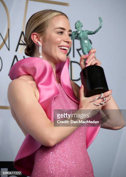 Emily Blunt poses in the press room with the award for Outstanding Performance by a Female Actor in a Supporting Role in 'A Quiet Place,' during the...