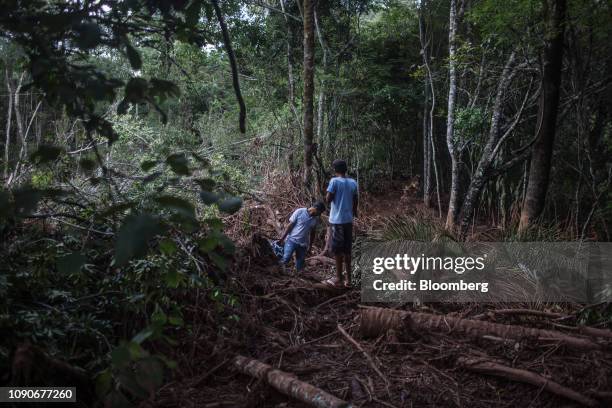 Rescue workers survey damage after a Vale SA dam burst in Brumadinho, Minas Gerais state, Brazil, on Monday, Jan. 28, 2019. Vale's dam breach has...