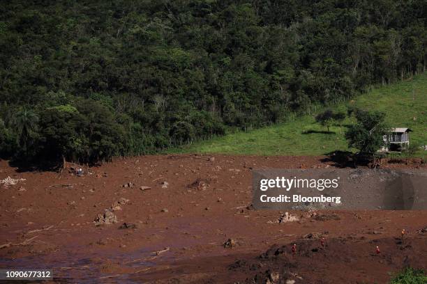 Rescue workers survey damage after a Vale SA dam burst in Brumadinho, Minas Gerais state, Brazil, on Monday, Jan. 28, 2019. Vale's dam breach has...