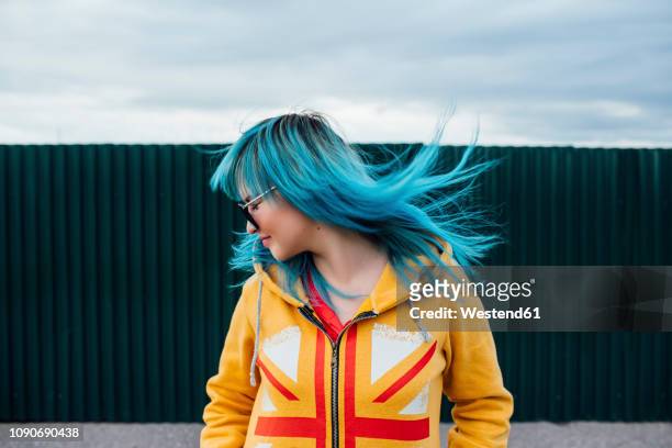 young woman with blowing dyed blue hair - dyed shades stock pictures, royalty-free photos & images