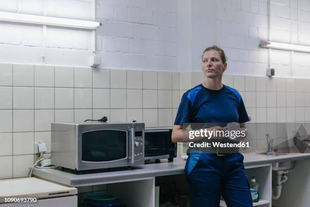 young woman working in high tech enterprise, taking a break, drinking coffee - microwave dish stock pictures, royalty-free photos & images