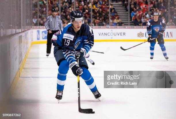 Anton Lundell of Finland skates with the puck in Gold Medal hockey action of the 2019 IIHF World Junior Championship against the United States on...