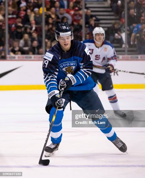 Rasmus Kupari of Finland skates with the puck in Gold Medal hockey action of the 2019 IIHF World Junior Championship against the United States on...