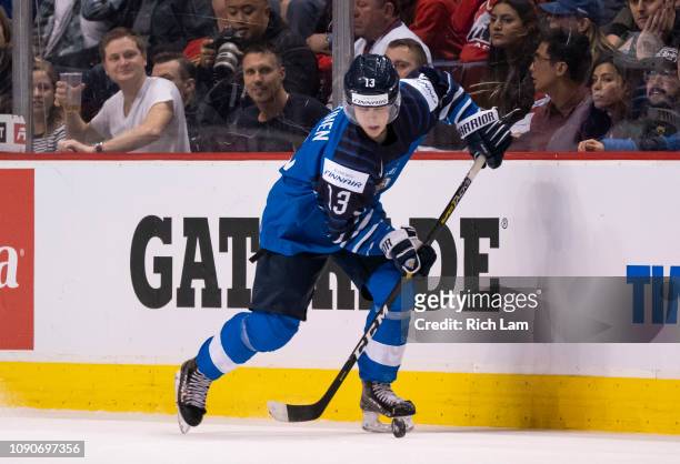 Valtteri Puustinen of Finland skates with the puck in Gold Medal hockey action of the 2019 IIHF World Junior Championship against the United States...