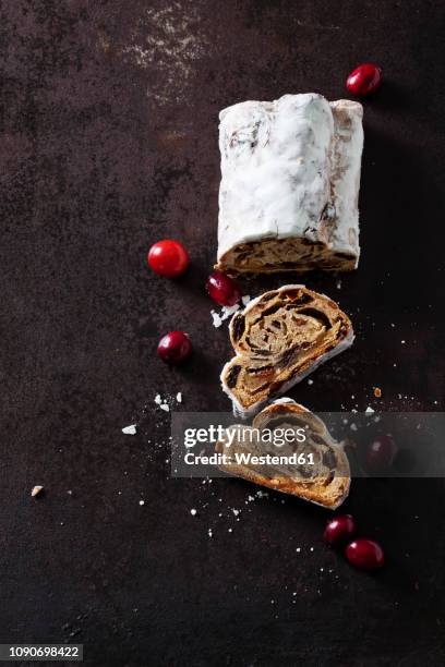 sliced christmas stollen with icing sugar - christmas cake stock pictures, royalty-free photos & images