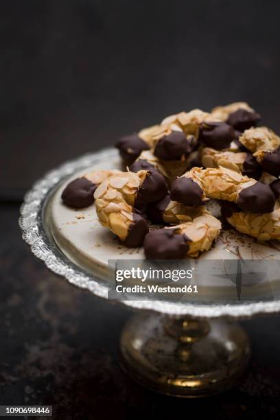 vegan almond crescents on cake stand - almond cookies stock pictures, royalty-free photos & images