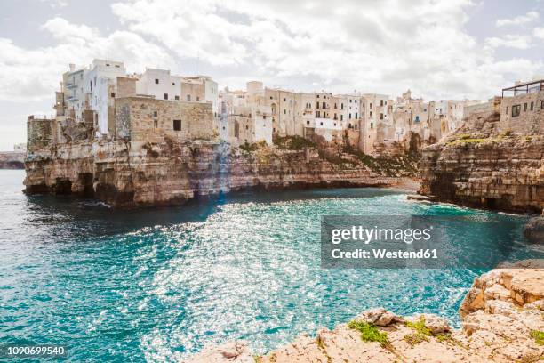 italy, puglia, polognano a mare, view to historic old town - adriatic sea italy stock pictures, royalty-free photos & images