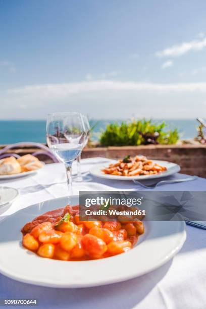 italy, atrani, plate of gnocchi with tomato sauce - mediterranean food stock pictures, royalty-free photos & images