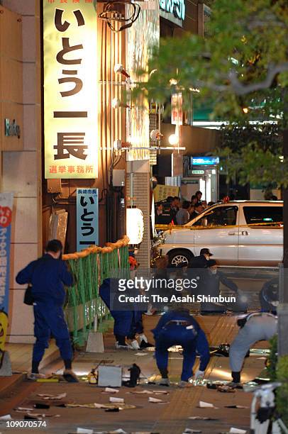 Police officers investigate the murder site of the incumbent Nagasaki Mayor Iccho Ito, or his real name Kazunaga Ito on the way back to his campaign...