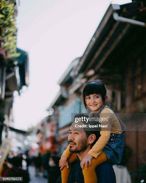 japanese father giving little girl piggyback ride, taiwan - eurasian stock pictures, royalty-free photos & images