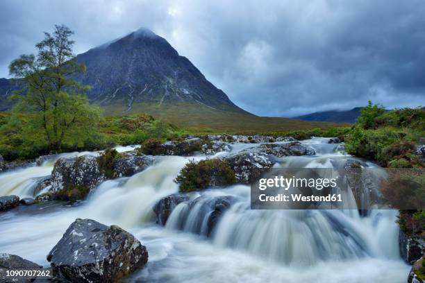 united kingdom, scotland, glencoe, highlands, glen coe, coupall falls of river coupall with mountain buachaille etive mor in background - glen etive mor stock pictures, royalty-free photos & images