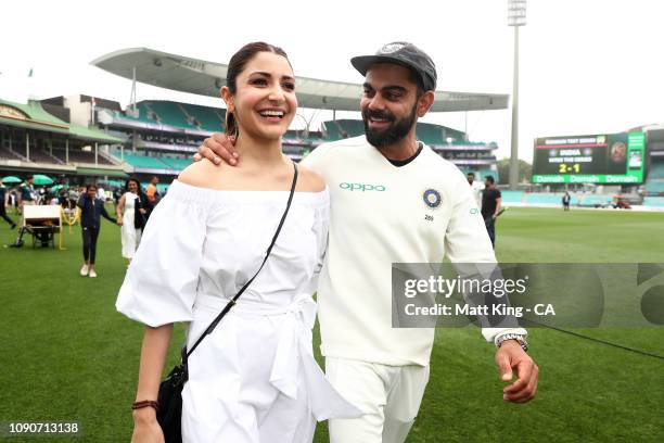 Indian captain Virat Kohli celebrates with his wife Anushka Sharma after winning the series and the Border–Gavaskar Trophy during day five of the...