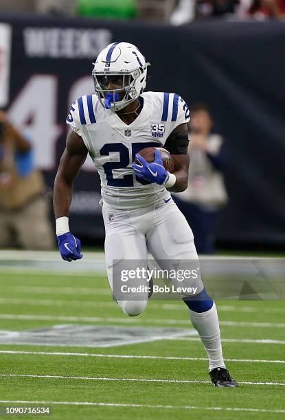 Marlon Mack of the Indianapolis Colts rushes with the ball against the Houston Texans during the Wild Card Round at NRG Stadium on January 05, 2019...