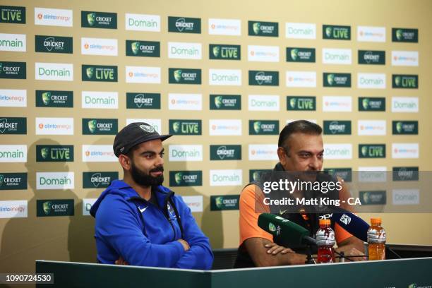 Indian captain Virat Kohli and Indian coach Ravi Shastri speak to the media during day five of the Fourth Test match in the series between Australia...