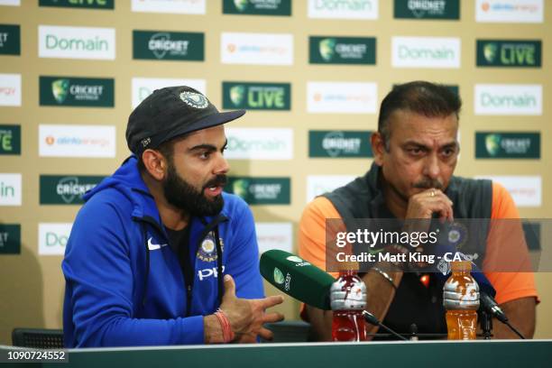 Indian captain Virat Kohli and Indian coach Ravi Shastri speak to the media during day five of the Fourth Test match in the series between Australia...