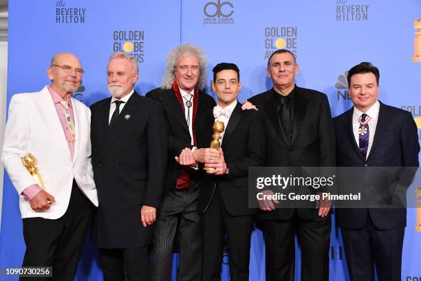 Jim Beach, Roger Taylor and Brian May of Queen, Rami Malek, Graham King, and Mike Myers pose in the press room during the 75th Annual Golden Globe...