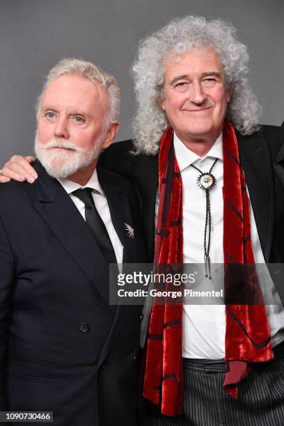 Roger Taylor and Brian May of Queen pose in the press room during the 75th Annual Golden Globe Awards held at The Beverly Hilton Hotel on January 06,...
