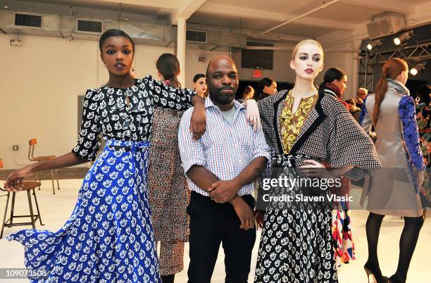 Designer Duro Olowu poses with models at the Duro Olowu Fall 2011 presentation during Mercedes-Benz Fashion Week at Milk Studios on February 13, 2011...