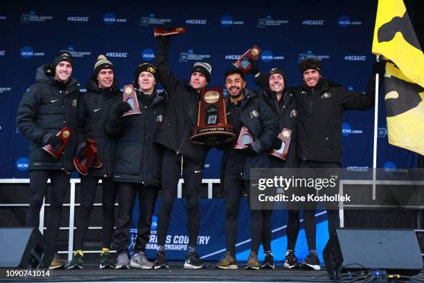 The Colorado Buffalos celebrates their fourth place finish during the Division I Men's Cross Country Championship held at the Thomas Zimmer...