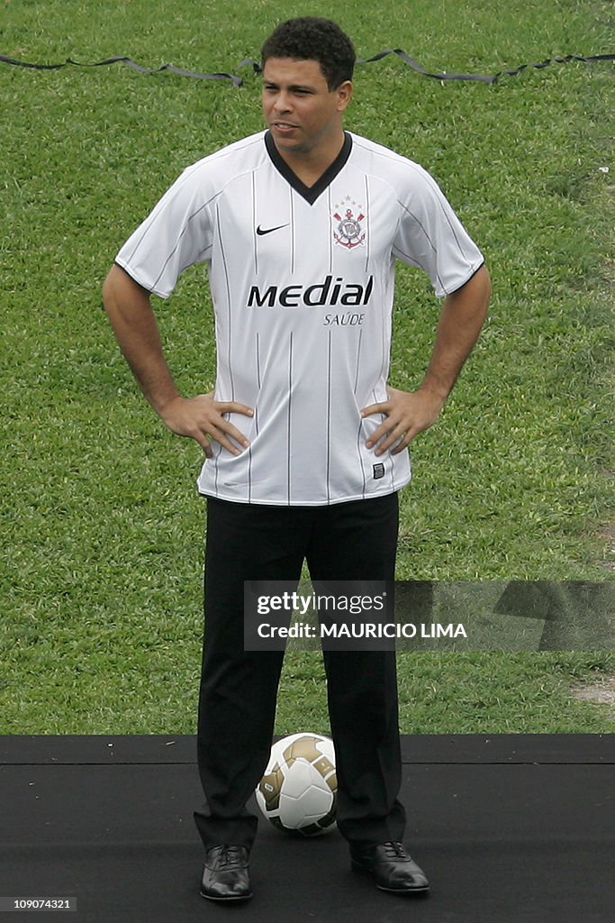 Brazilian football star Ronaldo poses on