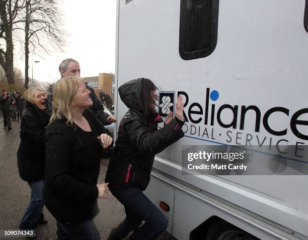People angry at the murder of Nikitta Grender react as the custody van containing Carl Whant leaves Caerphilly Magistrates Court on February 14, 2011...