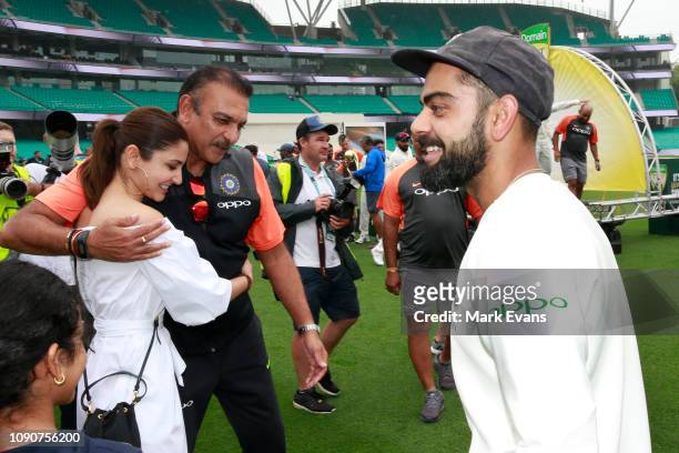 India Head Coach Ravi Shastri hugs Anushka Sharma, wife of Virat Kohli after India won the Series 2-1 during day five of the fourth Test match in the...