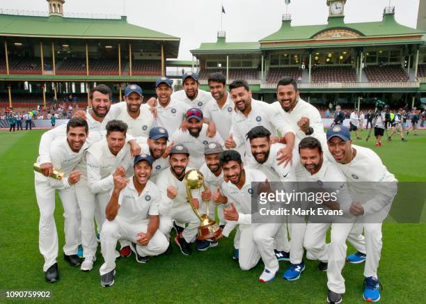The Indian Cricket Team celebrate winning the Border-Gavaskar trophy during day five of the fourth Test match in the series between Australia and...
