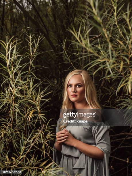 beautiful young woman out in green nature - strobe light stock pictures, royalty-free photos & images