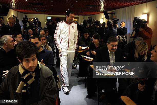 Milan's coach Massimiliano Allegri arrives for a press conference on the eve of his team's Champions League football match against Tottenham on...