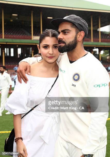 Indian captain Virat Kohli celebrates with his wife Anushka Sharma after winning the series and the Border–Gavaskar Trophy during day five of the...