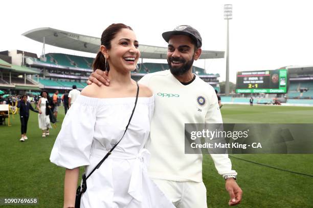 Indian captain Virat Kohli celebrates with his wife Anushka Sharma after winning the series and the Border–Gavaskar Trophy during day five of the...