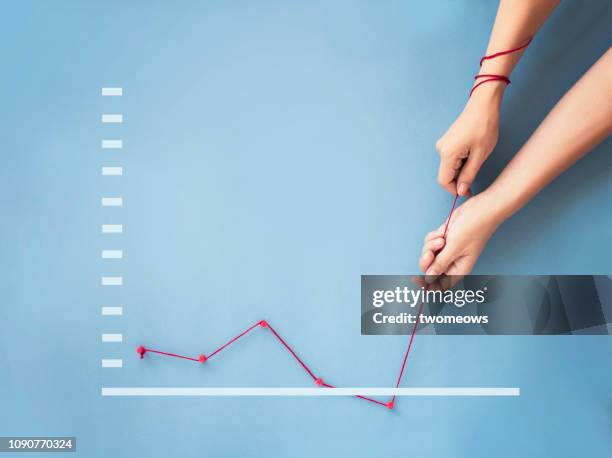 conceptual business finance growth chart still life. - roter faden stock-fotos und bilder