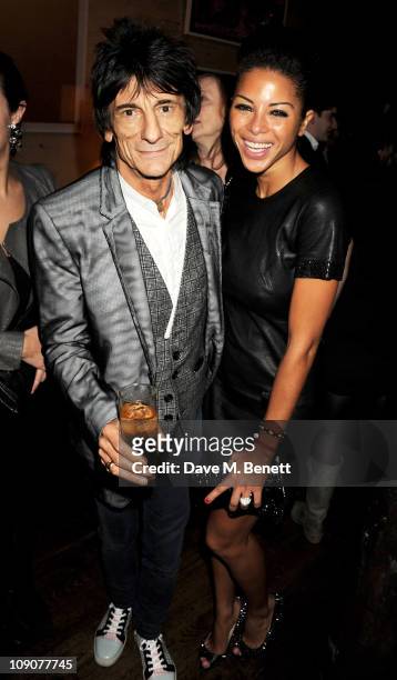 Musician Ronnie Wood and Ana Araujo attend a pre-BAFTA dinner celebrating best film nominee The King's Speech hosted by The Weinstein Company and...