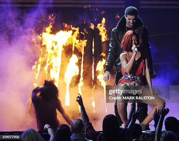 Singer Rihanna performs with Drake onstage during the Grammy Awards Show at the Staples Center in Los Angeles on February 13, 2011. Mick Jagger, Bob...