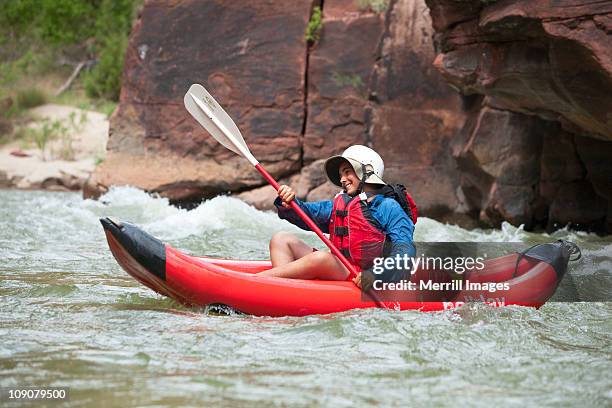 teenage boy kayaking green river (gates of lodore) - dinosaur national monument stock pictures, royalty-free photos & images