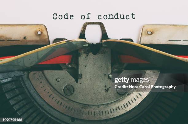 vintage typewriter with text - code of conduct - animal behavior stock-fotos und bilder