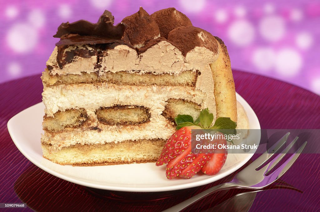 Close up of a piece of tiramisu cake on a plate