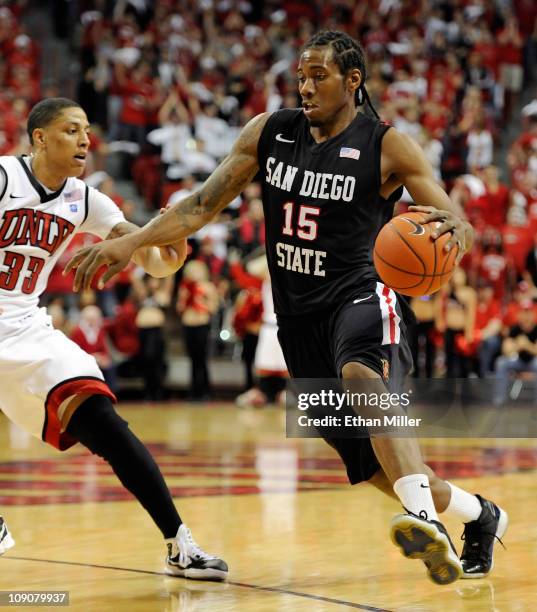 Kawhi Leonard of the San Diego State Aztecs drives against Tre'Von Willis of the UNLV Rebels during their game at the Thomas & Mack Center February...