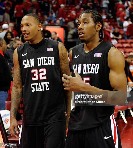 Billy White and and Kawhi Leonard of the San Diego State Aztecs celebrate their 63-57 victory over the UNLV Rebels at the Thomas & Mack Center...