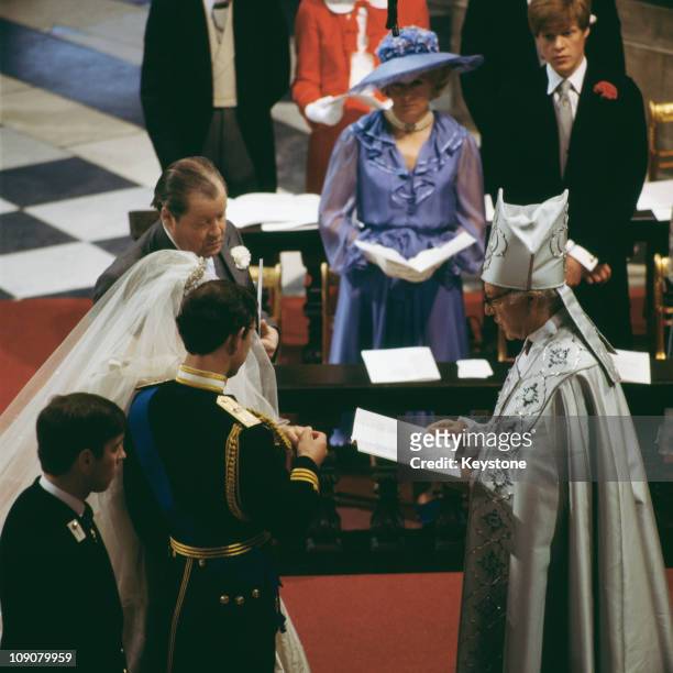 The wedding of Charles, Prince of Wales, and Lady Diana Spencer at St Paul's Cathedral in London, 29th July 1981. Prince Andrew is beside his brother...