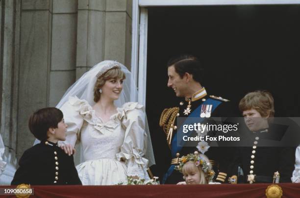 Newlyweds Prince Charles and Princess Diana, Princess of Wales on the balcony at Buckingham Palace to greet the crowds, London, 29th July 1981. Their...