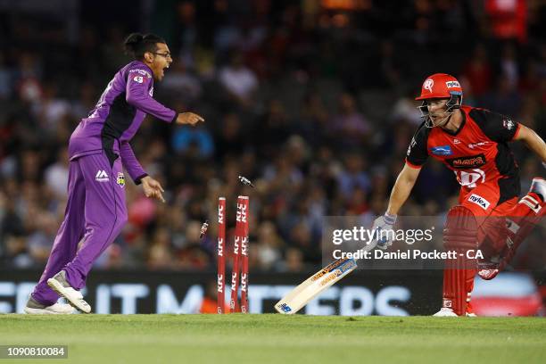 Aaron Finch of the Renegades is run out by Johan Botha of the Hurricanes during the Big Bash League match between the Melbourne Renegades and the...