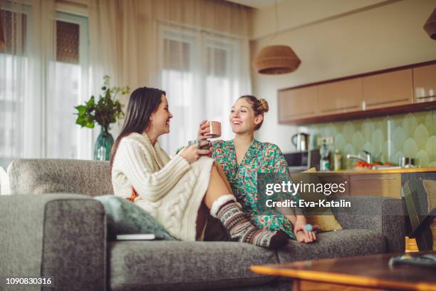 young women at home - drink coffee stock pictures, royalty-free photos & images