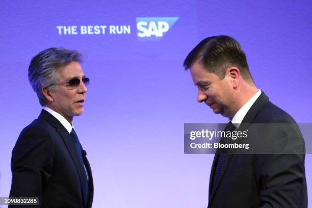 Bill McDermott, chief executive officer of SAP AG, left, and Luka Mucic, chief financial officer of SAP SE, depart following a full year earnings...