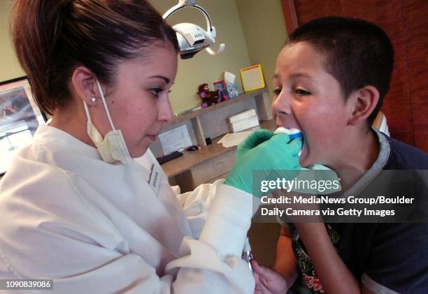 Brandon Burgoyne gets a fluoride treatment from dental assistant Jennifer Zamora-Garcia on Wednesday afternoon at Foothills Pediatric Dentistry in...