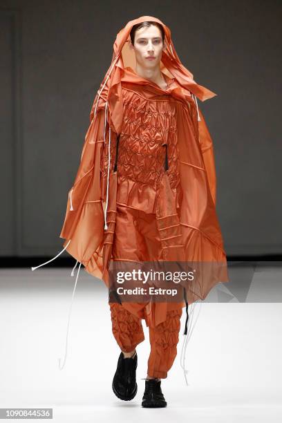 Model walks the runway at the Craig Green show during London Fashion Week Men's January 2019 on January 7, 2019 in London, England.