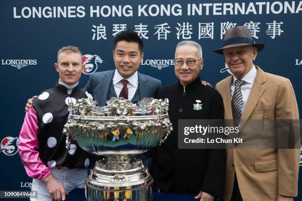 Owner representative of Beauty Generation Patrick Kwok Ho Chuen, Simon Kwok Siu Ming , trainer John Moore and jockey Zac Purton celebrate after...